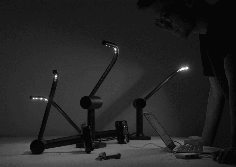 Yitong Sun working with a light simulation device.